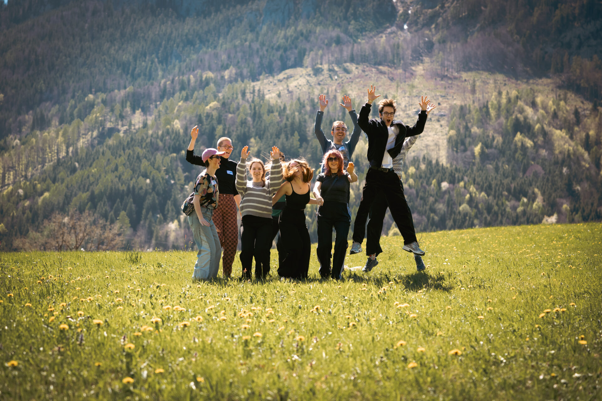 The Austrian EuroPeers are posing together in Spital am Pyhrn, with the Baroque façade of the hotel in the background.