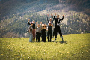 The Austrian EuroPeers are posing together in Spital am Pyhrn, with the Baroque façade of the hotel in the background.